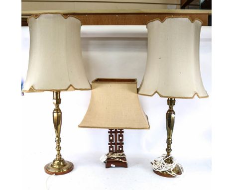 An Oriental design table lamp and shade, height 54cm, and a pair of brass table lamps with shades 