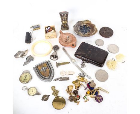 A box of interesting items, including badges, bell, miniature shoe, Royal memorabilia, oil lamp etc 