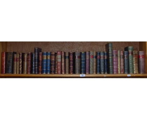 A shelf of Antique leather-bound books, including Schiller and Voltaire 