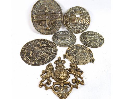 A collection of 7 Vintage brass safe plaques, including Milners and Ratners, 1 with coat of arms, height 22.5cm 