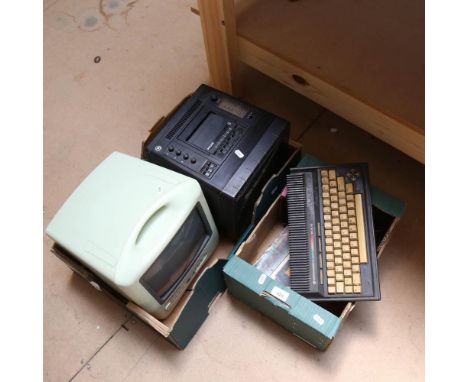 A Vintage Commodore Plus 4 computer, a cassette drive and joystick, a Philips TV radio cassette player, and a Thomson Life mo
