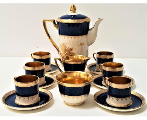 CROWN DEVON FIELDINGS COFFEE SETdecorated in blue and gilt, the cups, milk jug and sugar bowl with gilt interiors, comprising