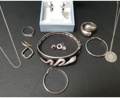 SELECTION OF SILVER JEWELLERY comprising a crystal snake decorated bangle, a CZ ring, another bulbous twist design ring, a pa