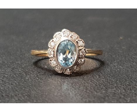 BLUE TOPAZ AND DIAMOND CLUSTER RINGthe central oval cut topaz approximately 0.75cts in twelve diamond surround, on nine carat