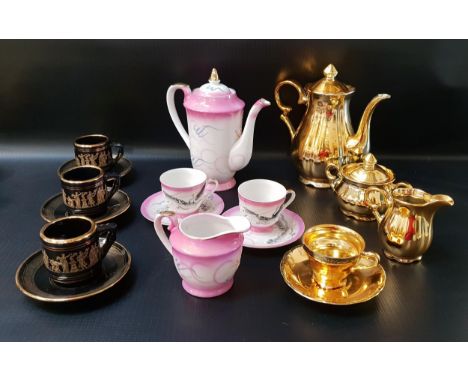 GILT COFFEE SETcomprising six cups, four saucers, cream jug, lidded sugar bowl and lidded coffee pot; a black ground coffee s