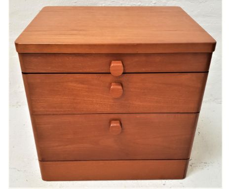 TEAK SMALL BEDSIDE CHESTwith a pull out shelf above two drawers, standing on a plinth base, 55cm high 