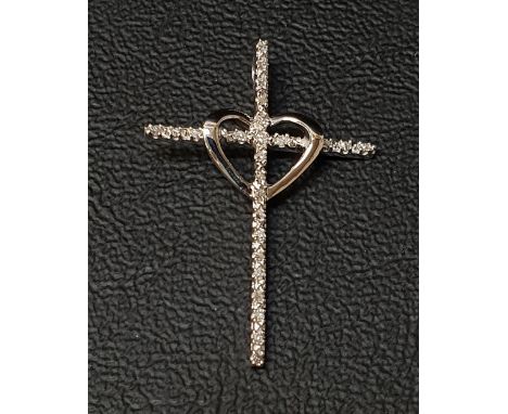 DIAMOND SET CROSS PENDANTwith central heart detail, in unmarked white gold, 3.2cm high 