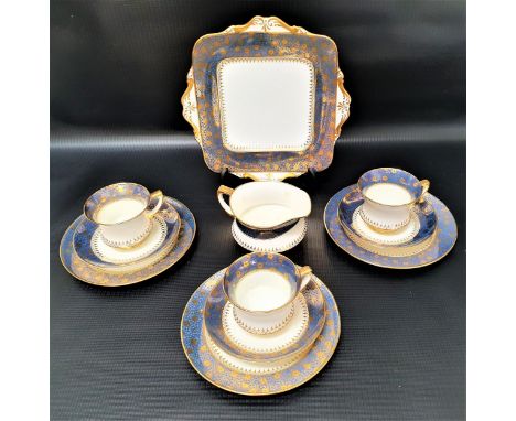 PARAGON TEA SERVICEwith a white ground and light blue border with gilt flowers, comprising cups and saucers, side plates, san