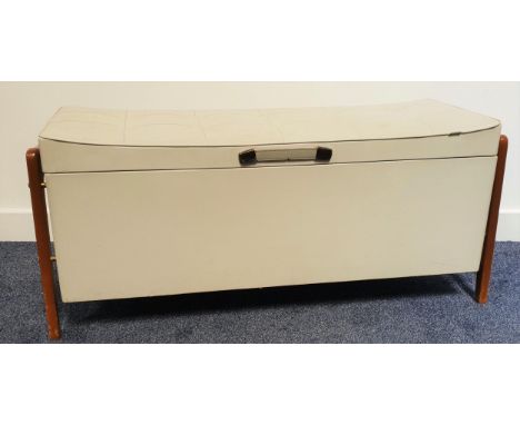 OTTOMANin grey vinyl with a button back lift up lid, standing on shape teak supports, 95cm wide 