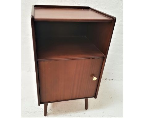 LEGATE TEAK BEDSIDE CHESTwith a tray top above an open shelf with a cupboard below, standing on turned supports, 68.5cm high 