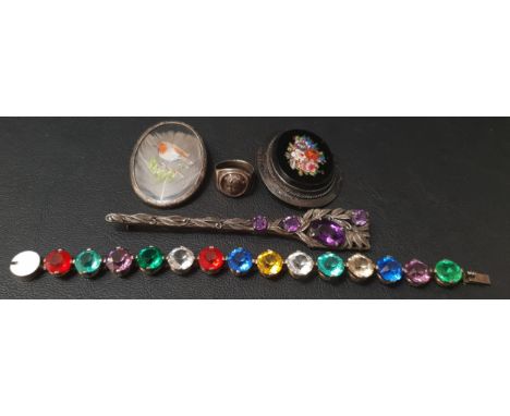 SELECTION OF JEWELLERYcomprising an amethyst set unmarked silver kilt pin, a paste set bracelet in unmarked silver, a floral 