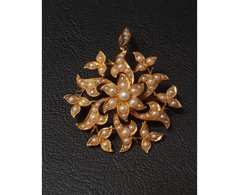 EDWARDIAN SEED PEARL SET BROOCH/PENDANTin fifteen carat gold, 3.6cm wide 