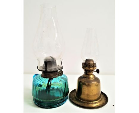 VINTAGE GLASS OIL LAMPthe blue ribbed glass reservoir with handle and a clear glass stack, 30.5cm high, together with a simil