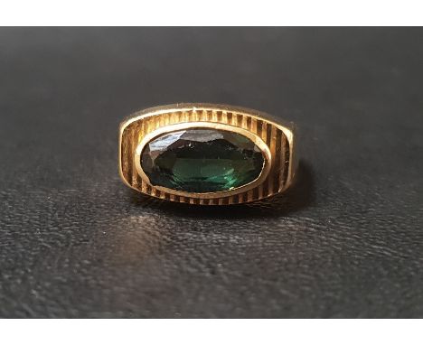 GREEN TOURMALINE DRESS RINGthe single oval cut tourmaline approximately 2cts in bezel setting, on nine carat gold shank, ring