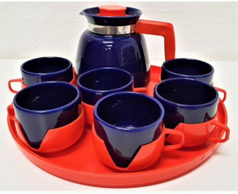 RETRO 1980s COFFEE SETthe six blue ceramic cups in red plastic holders, the blue coffee pot with red plastic handle and cover