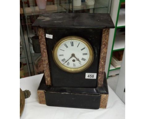 A black slate mantel clock