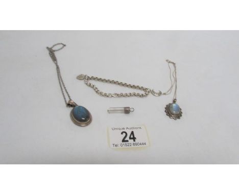 2 silver pendants on chain, one other and a silver bracelet