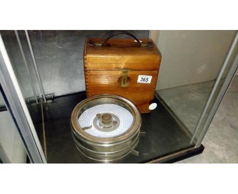 An oak cased pigeon clock by the Automatic Timing Clock Co.,