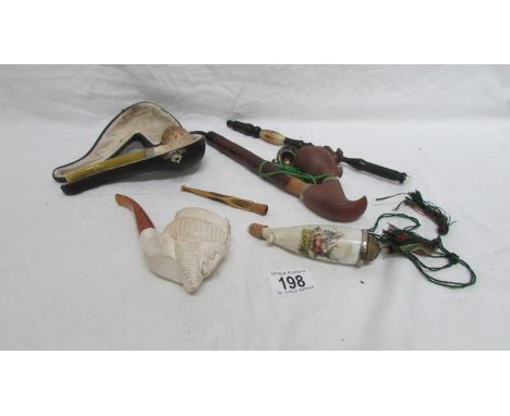 4 vintage pipes and a cheroot holder