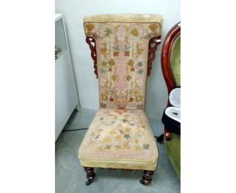 A Victorian mahogany tapestry upholstered nursing chair