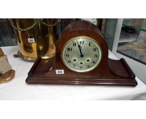 A mahogany mantel clock