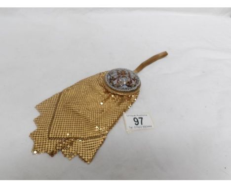 An unusual vintage beaded wrist purse with incorporated powder compact
