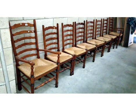 A set of 8 oak ladder back chairs