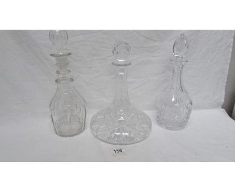 A cut glass ships decanter and 2 others