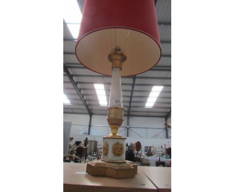 An ornate table lamp with shade