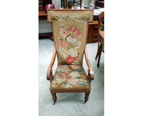 A 19th Century nursing chair with floral tapestry seat