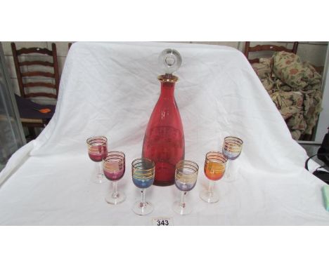 A coloured glass decanter & 6 glasses