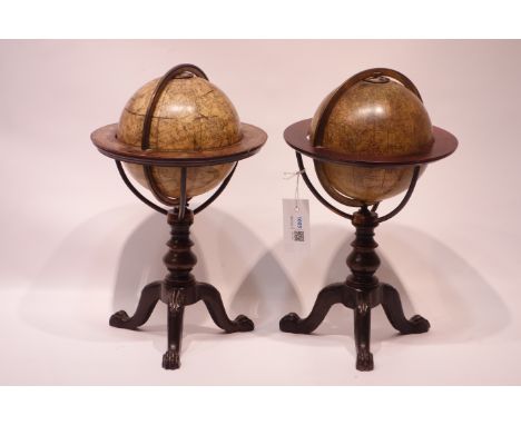 Pair of 19th century Celestial & Terrestrial Table Globes by Kirkwood`s with brass meridian rings, on cast iron and wood trip