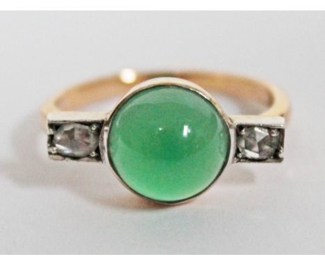 An Art Deco diamond and jade cabochon ring, yellow metal band unmarked, gross wt. 4.9g, size R.