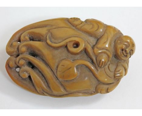 A Chinese carved jade pebble, length 8cm.
