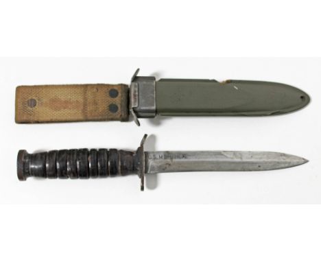 An American WWII M3 fighting knife, the blade marked 'U.S. M3-UTICA' and the scabbard 'US M8 BM CO', length 31.5cm. Condition