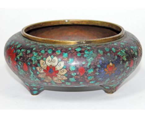 A Chinese cloisonné three footed bowl, seal to base, diam. 22.5cm. Condition - various losses, holes and dents...