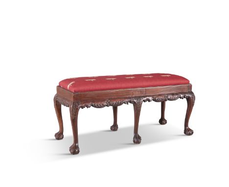 A CHIPPENDALE STYLE MAHOGANY FRAMED DUET/WINDOW SEAT, with upholstered drop-in seat raised on a scroll carved apron cabriole 