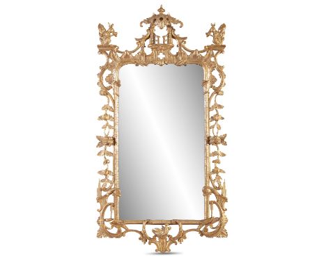 AN IMPORTANT GEORGE III IRISH CARVED GILTWOOD FRAMED MIRROR, in the Chinese Chippendale taste, the cresting decorated with cu
