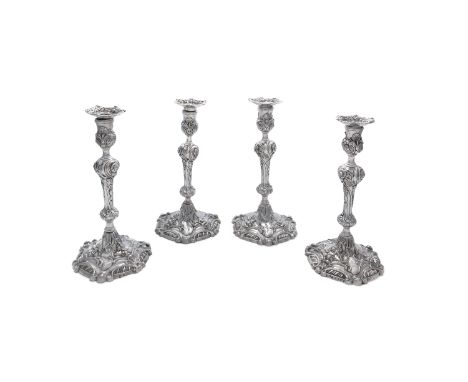 A SET OF FOUR IRISH SILVER CANDLESTICK, three c.1770 mark of Townsend &amp; Craig and one Victorian, Dublin 1877 to match, in