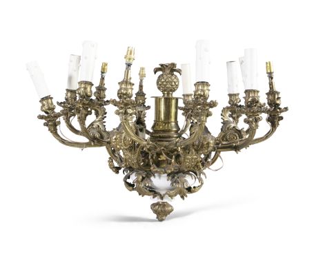 A CAST BRASS TWELVE-BRANCH CEILING LIGHT, the pineapple corona and baluster column issuing each naturalistically formed branc