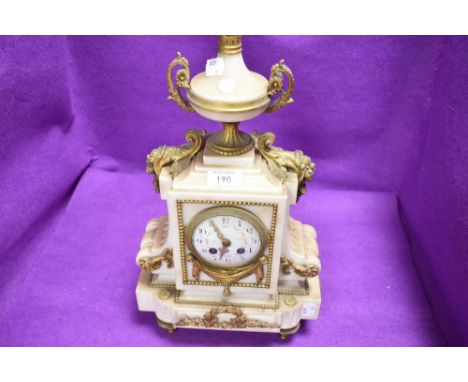 An antique French styled mantle clock having marble case with ormolu decals
missing pendulum,some decals slightly loose but a