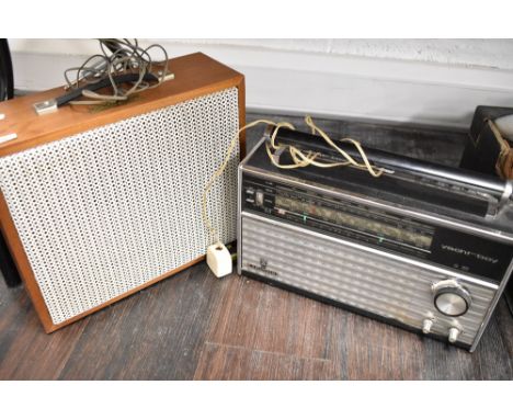 A Coumber Worcester F10 speaker cabinet and a Grundig Yacht boy radio set