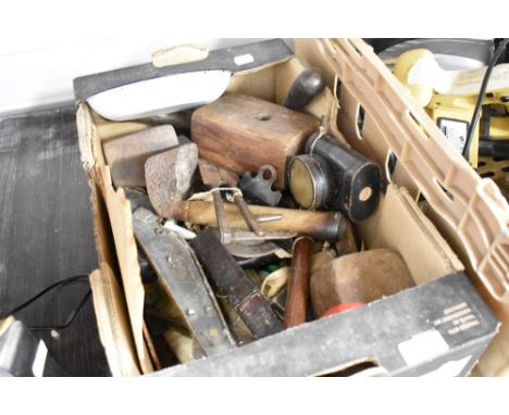 A selection of various hardware including razor, mallet and lamp