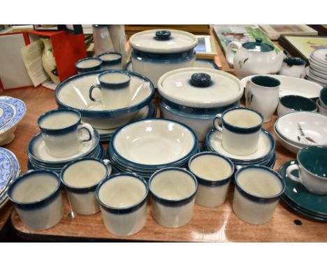 A selection of tea and dinner wares by Wedgwood in the Blue Pacific pattern
8x teacups one slight flea bite to rim of one
9x 