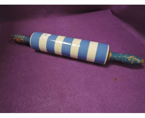 A kitchen rolling pin having a ceramic body by T.G Green on a green stamp