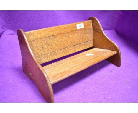 A vintage oak book trough or shelf