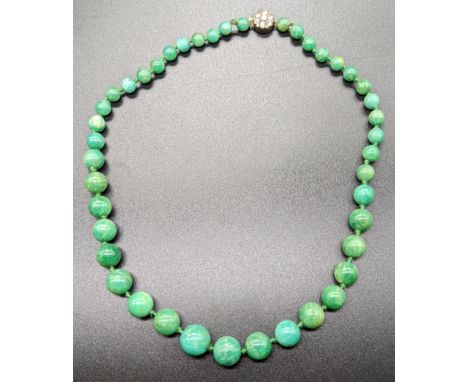 A Chinese green jade bead necklace