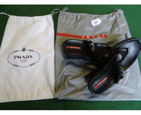 A pair of ladies Prada wedge heeled toe-post sandals, size 36, with original dust bag and carry bag.