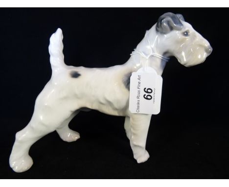 Copenhagen Terrier, circa 1952, printed and painted marks to base, no. 1998, carrying the initial 'R', 14cm tall.