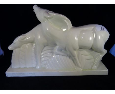 An Art Deco ceramic deer group, impressed with the name Le Manceau, 22.5cm wide.